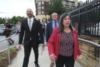 Former CDC officials Dan Jernigan Deb Houry, and Demetre Daskalakis walk out of the headquarters building.