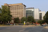 A photo taken from the street of a large, modern office building in Rockville, Maryland.