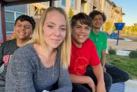 A photo shows GlendaRika Garcia sitting outside with her kids.