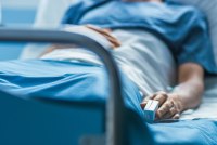 A patient lying in a hospital bed.