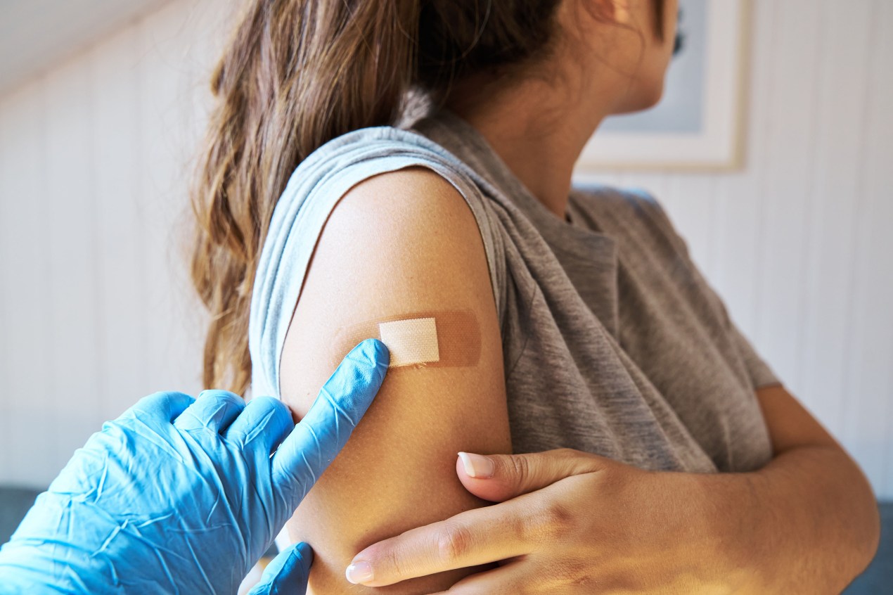 A close up view of a woman getting vaccinated.