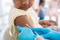 A photo of a young child getting vaccinated.