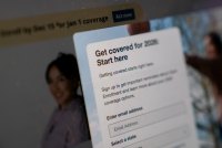 A photo of HealthCare.gov's website. A pop-up form reads, "Get covered for 2026. Start here."