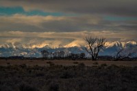 A landscape photograph of a mountain-scape in Colorado at sunset.