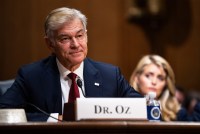 A photo of Mehmet Oz sitting in a Senate hearing room.