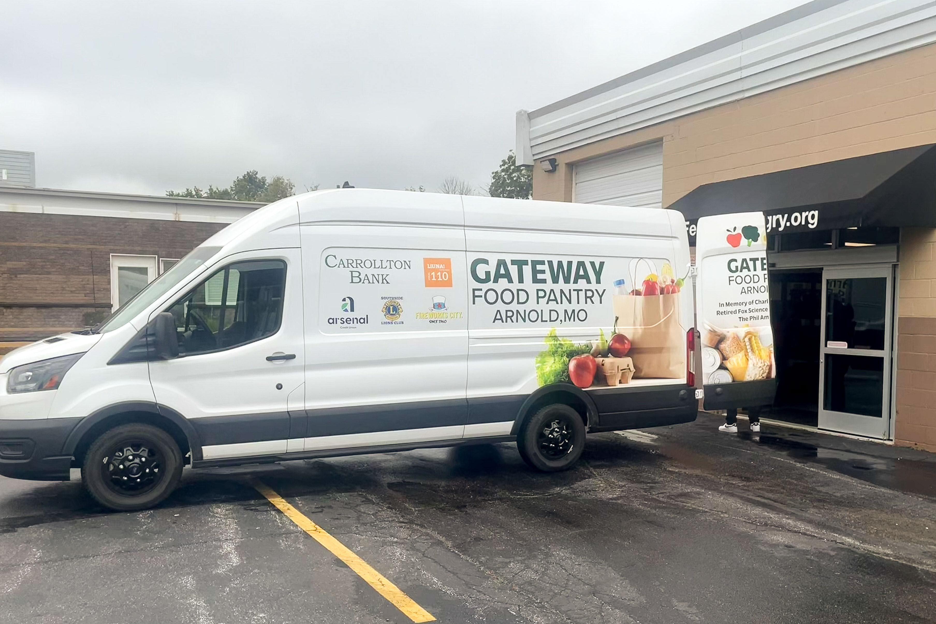 A white van with the words "Gateway Food Pantry" in green on the side